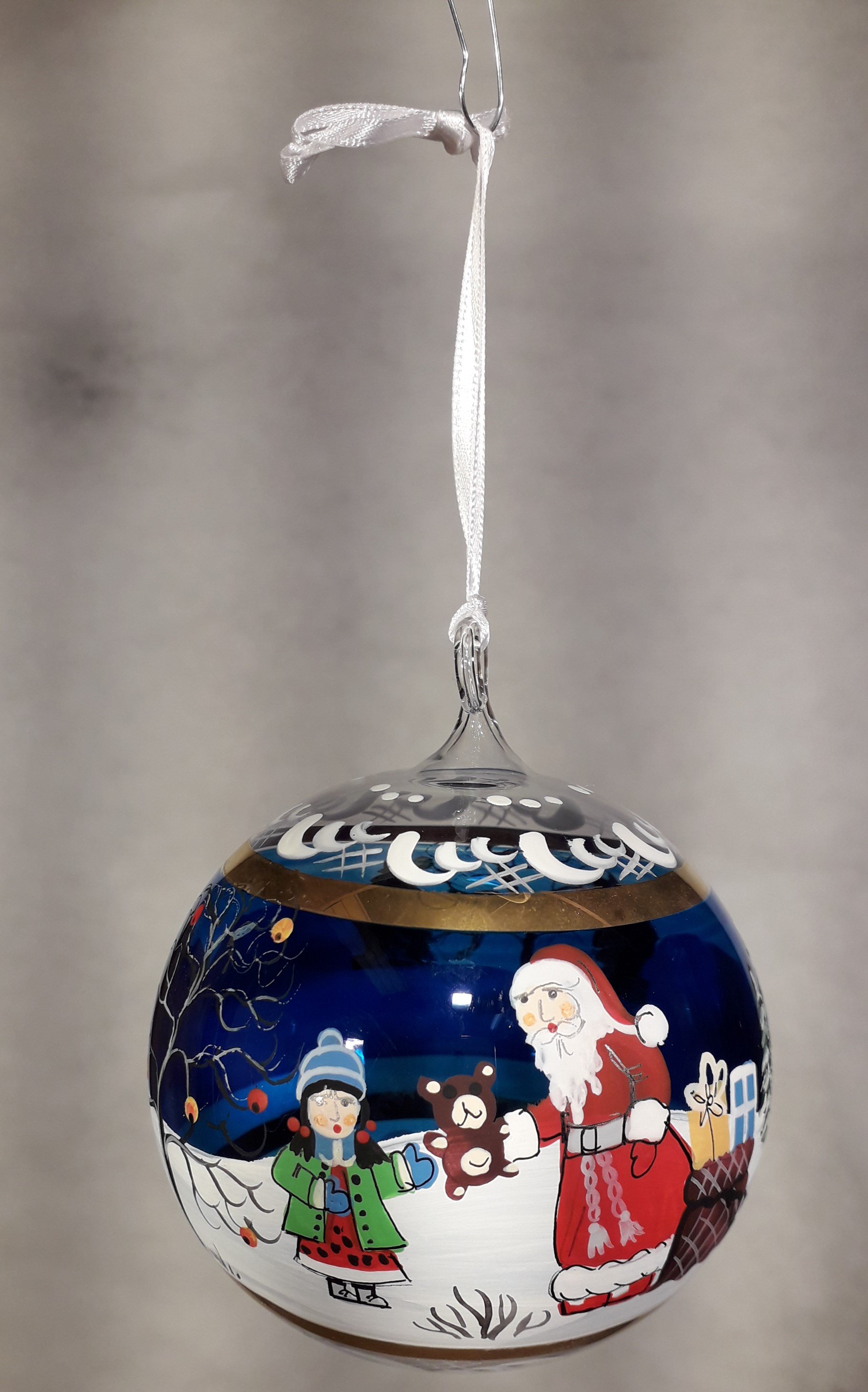 Babbo Natale con regalo blu